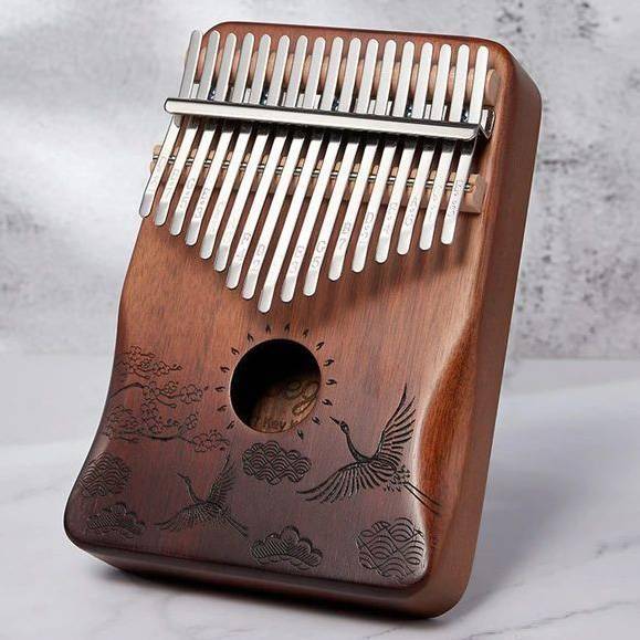 learning to play kalimba. what do the brackets mean? there are a